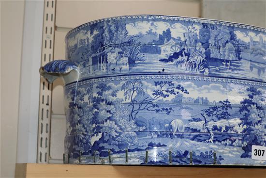 A 19th century Staffordshire blue and white foot bath (restored), with a small table